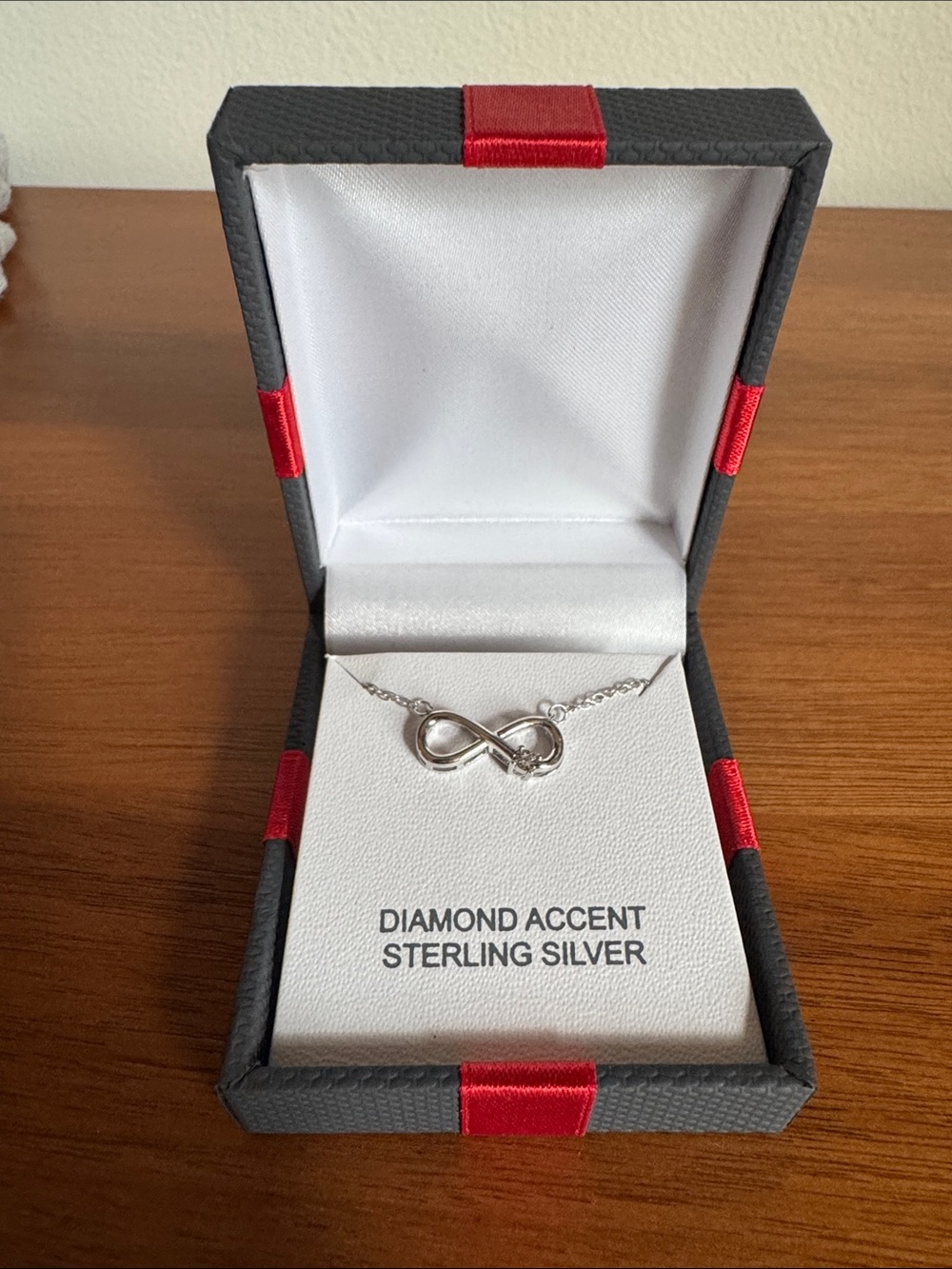 Sterling Silver Infinity Necklace with Diamond Accent - Silver